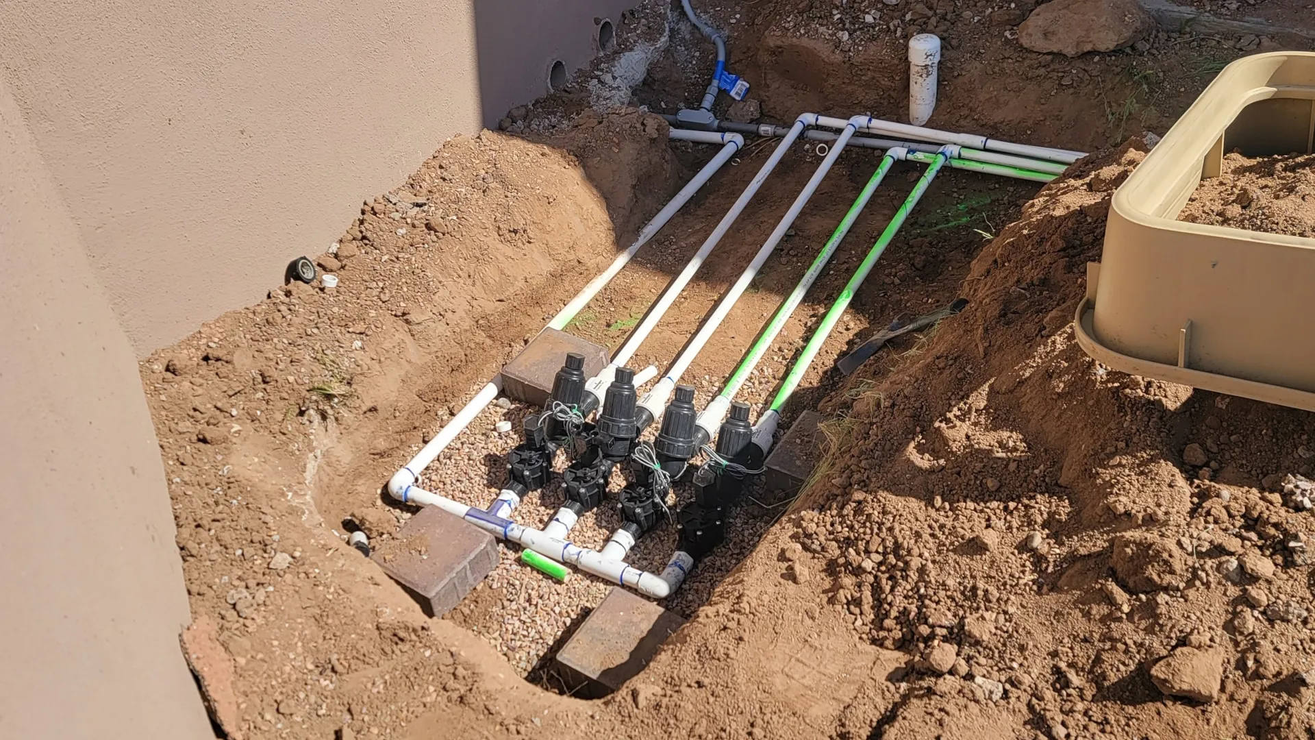 Professional irrigation system installation in a Tucson residential yard.